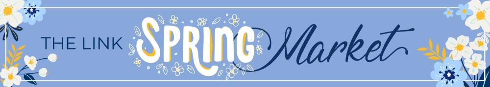 blue banner with flowers and the words the Link Spring Market